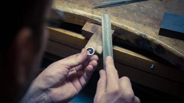 Goldsmith working on wedding ring